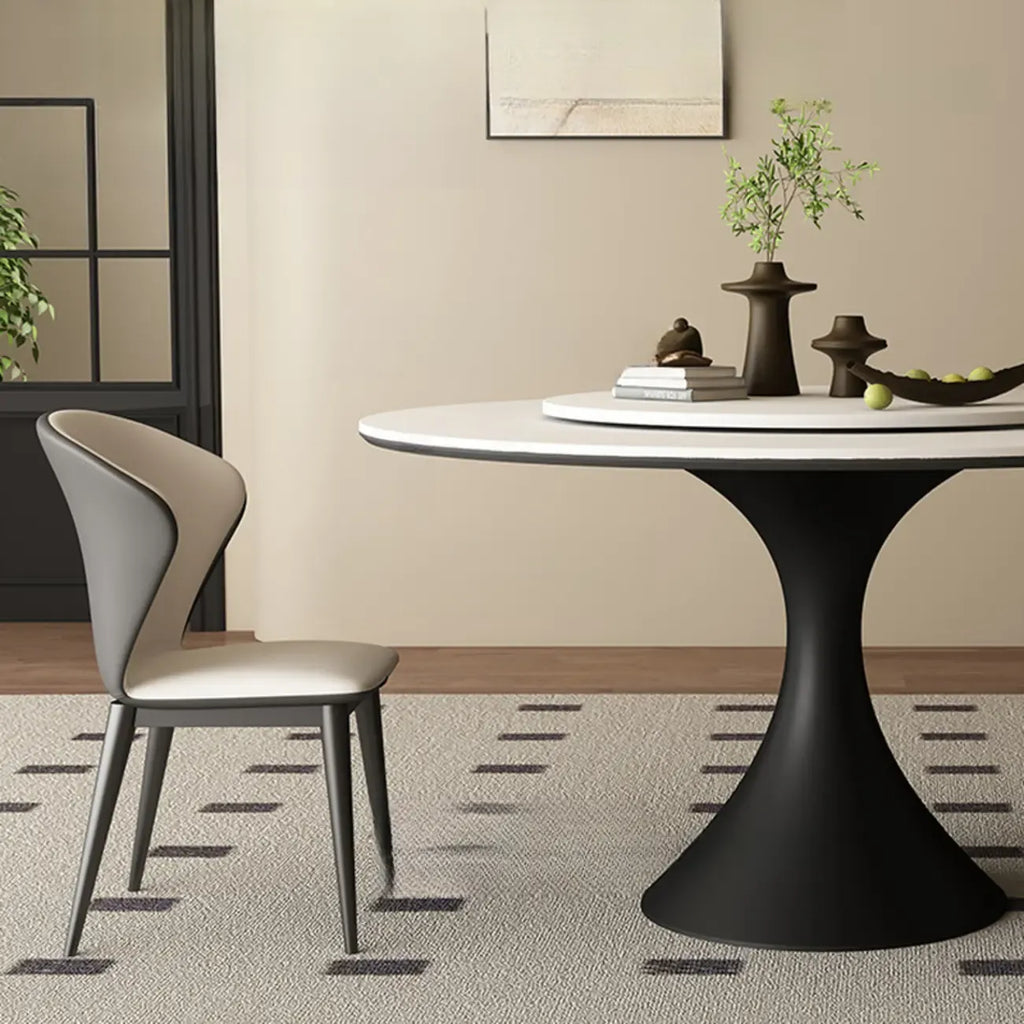 Table de salle à manger ronde moderne avec pied noir et plateau en pierre blanche