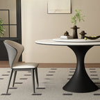 Table de salle à manger ronde moderne avec pied noir et plateau en pierre blanche