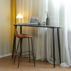 Table de bar moderne avec plateau en travertin gris et pieds en métal, idéale pour la salle à manger.