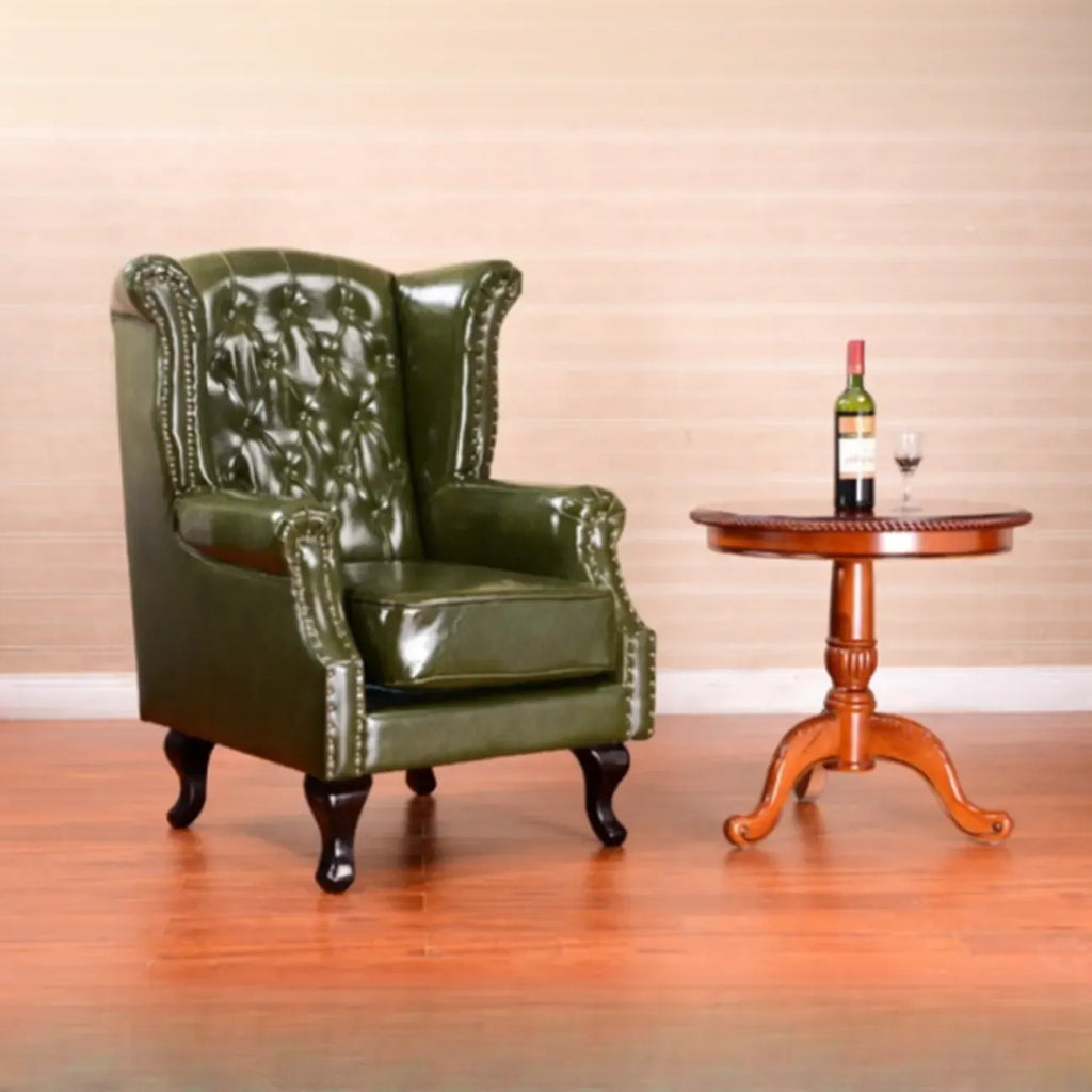 Poltrona Chesterfield tradizionale in pelle con profilo borchiato