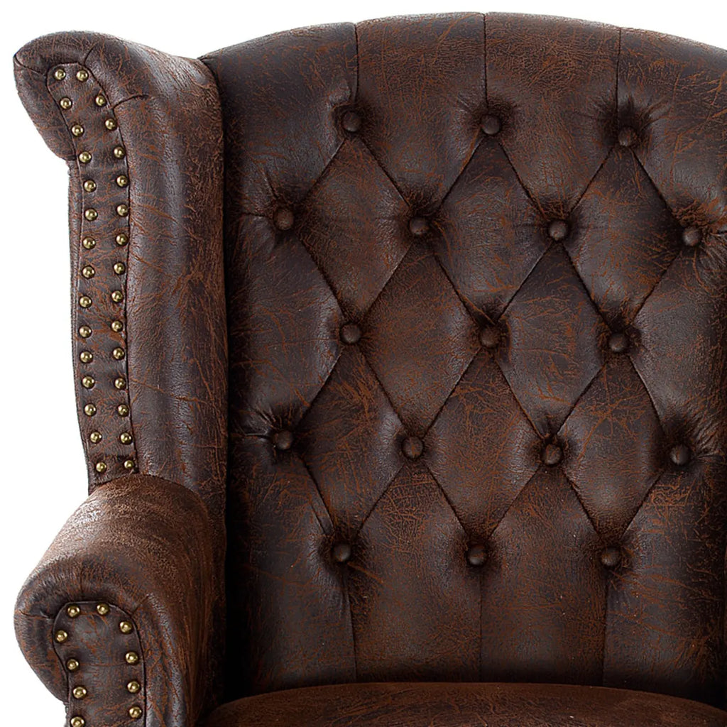 Poltrona Chesterfield tradizionale in pelle con profilo borchiato