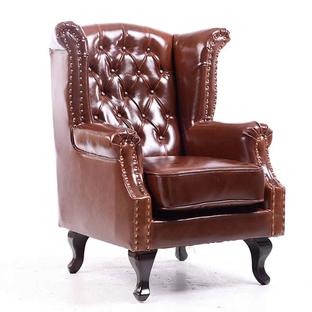 Poltrona Chesterfield tradizionale in pelle con profilo borchiato