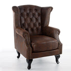 Poltrona Chesterfield tradizionale in pelle con profilo borchiato