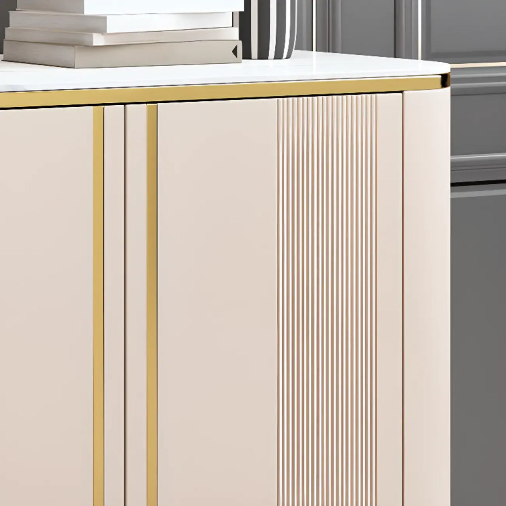 Armoire de rangement en métal doré avec grand plateau en pierre et sans poignée, style glamour