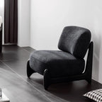 Fauteuil crapaud moderne en tissu noir avec coussin