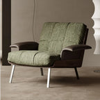 Fauteuil lounge moderne à accoudoirs évasés en tissu vert