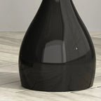 Table d'appoint ronde en pierre brune de style scandinave