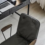 Élégant fauteuil de bureau pivotant en métal et cuir gris avec roulettes