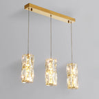 Suspension cylindrique en cristal pour îlot de cuisine, éclairage LED à intensité variable.