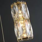 Suspension cylindrique en cristal pour îlot de cuisine, éclairage LED à intensité variable.