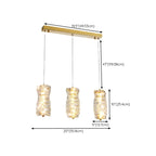 Suspension cylindrique en cristal pour îlot de cuisine, éclairage LED à intensité variable.