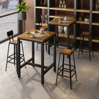 Table haute de bar de style industriel avec plateau en bois et repose-pieds pour les repas
