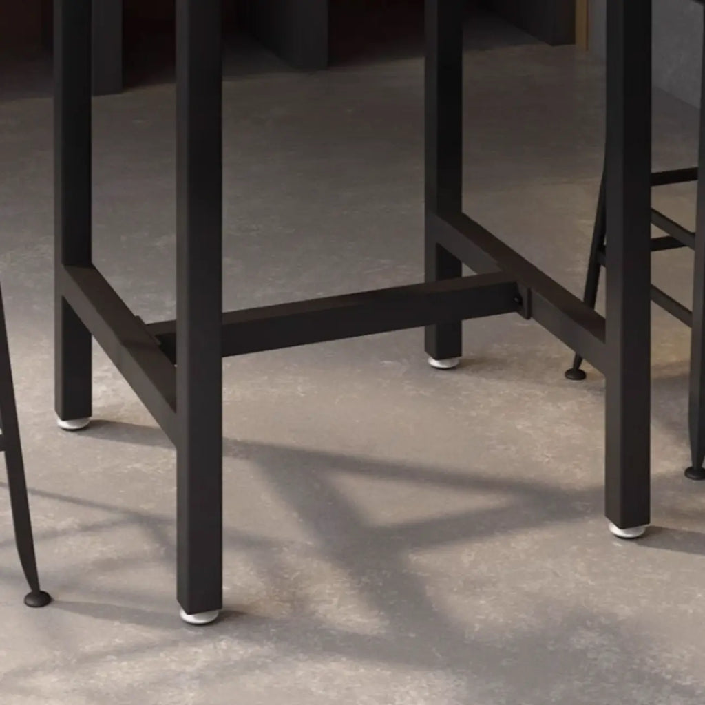 Table haute de bar de style industriel avec plateau en bois et repose-pieds pour les repas