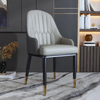 Chaise de salle à manger glamour en similicuir avec dossier incurvé et accoudoirs