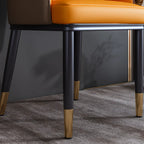 Chaise de salle à manger glamour en similicuir avec dossier incurvé et accoudoirs