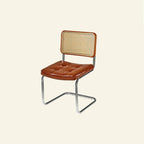 Chaise de salle à manger moderne marron à dossier tissé, en similicuir marron, à dossier cantilever.