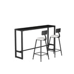 Table de bar moderne avec plateau en pierre noire, piètement à tréteaux et repose-pieds