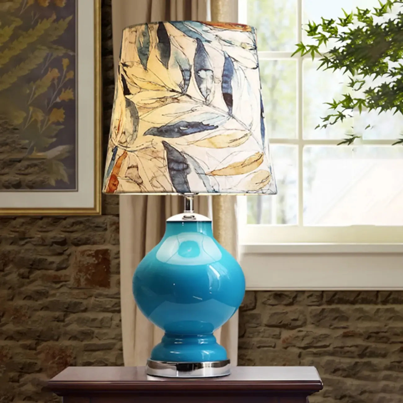 Lampe de table en verre bleu avec abat-jour en tissu à motif de feuilles