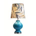 Lampe de table en verre bleu avec abat-jour en tissu à motif de feuilles