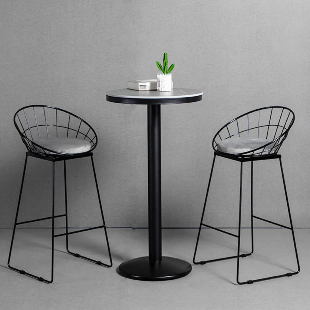 Table de bar ronde en pierre gris industriel, hauteur 2 places