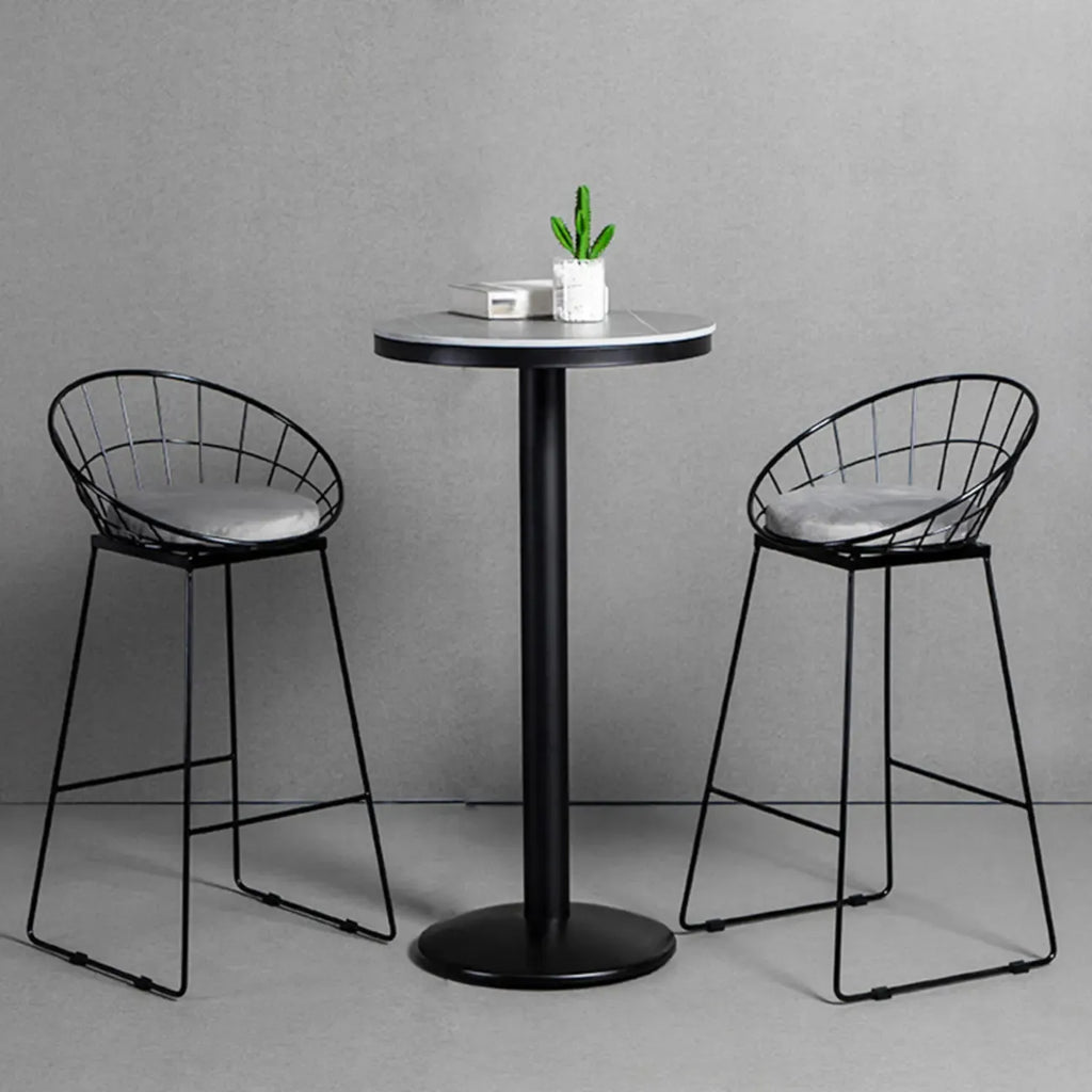 Table de bar ronde en pierre gris industriel, hauteur 2 places
