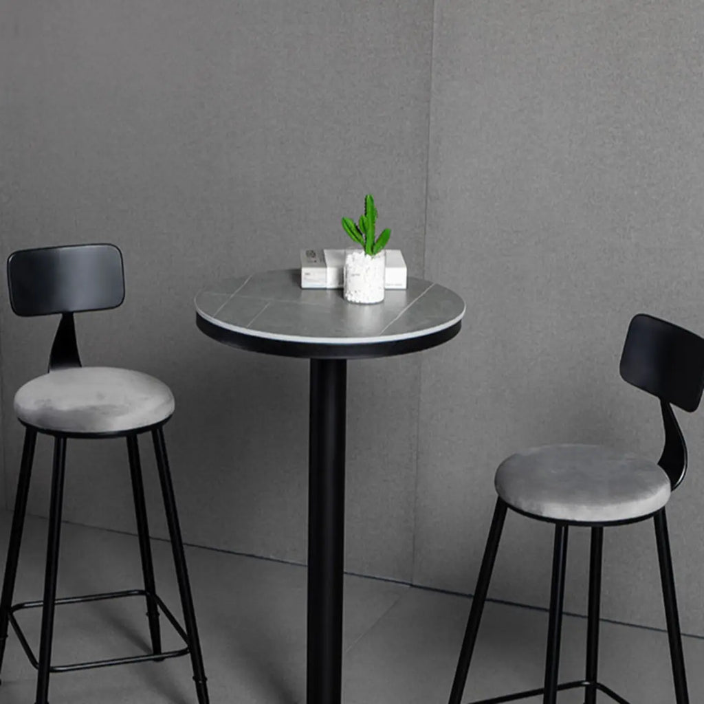 Table de bar ronde en pierre gris industriel, hauteur 2 places