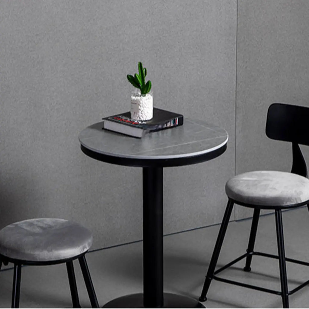Table de bar ronde en pierre gris industriel, hauteur 2 places