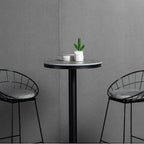 Table de bar ronde en pierre gris industriel, hauteur 2 places