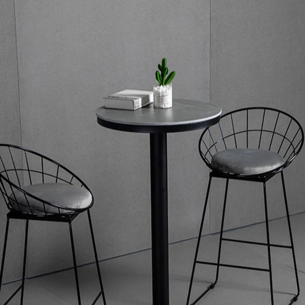 Table de bar ronde en pierre gris industriel, hauteur 2 places