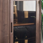 Vitrine autoportante en bois brun avec porte vitrée