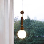 Suspension minimaliste en bois et verre noir avec globe lumineux