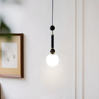 Suspension minimaliste en bois et verre noir avec globe lumineux