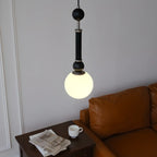 Suspension minimaliste en bois et verre noir avec globe lumineux