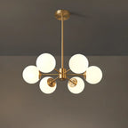 Lustre Sputnik doré moderne avec globe en verre blanc