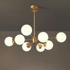 Lustre Sputnik doré moderne avec globe en verre blanc