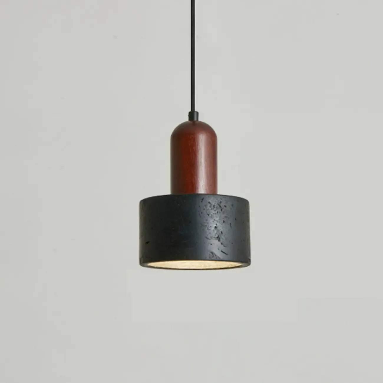 Suspension cylindrique en bois et pierre noire pour chambre