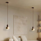 Suspension cylindrique en bois et pierre noire pour chambre
