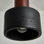 Suspension cylindrique en bois et pierre noire pour chambre