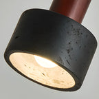 Suspension cylindrique en bois et pierre noire pour chambre
