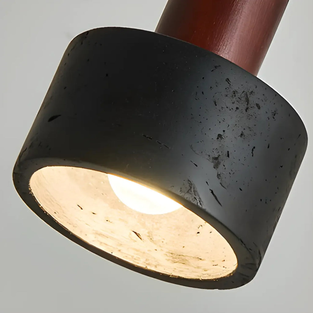 Suspension cylindrique en bois et pierre noire pour chambre