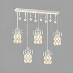 Suspension élégante cylindrique en cristal pour îlot de cuisine avec projecteur