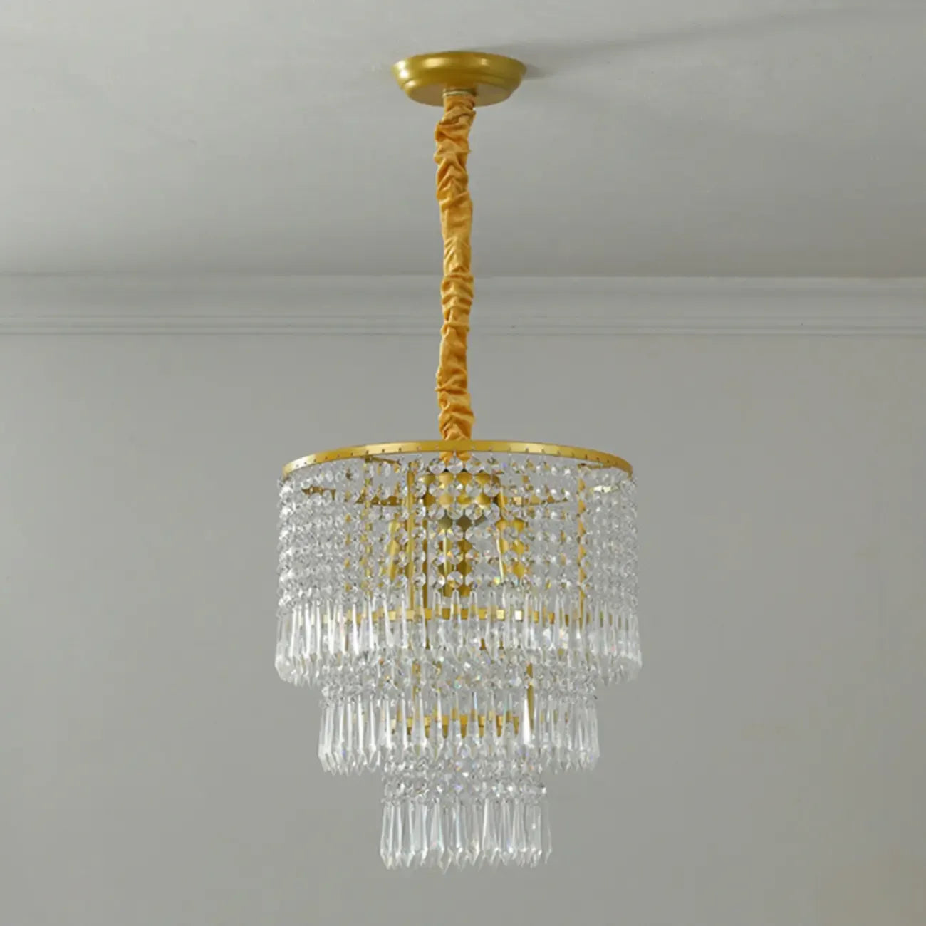 Lustre rond moderne en cristal doré à suspension descendante