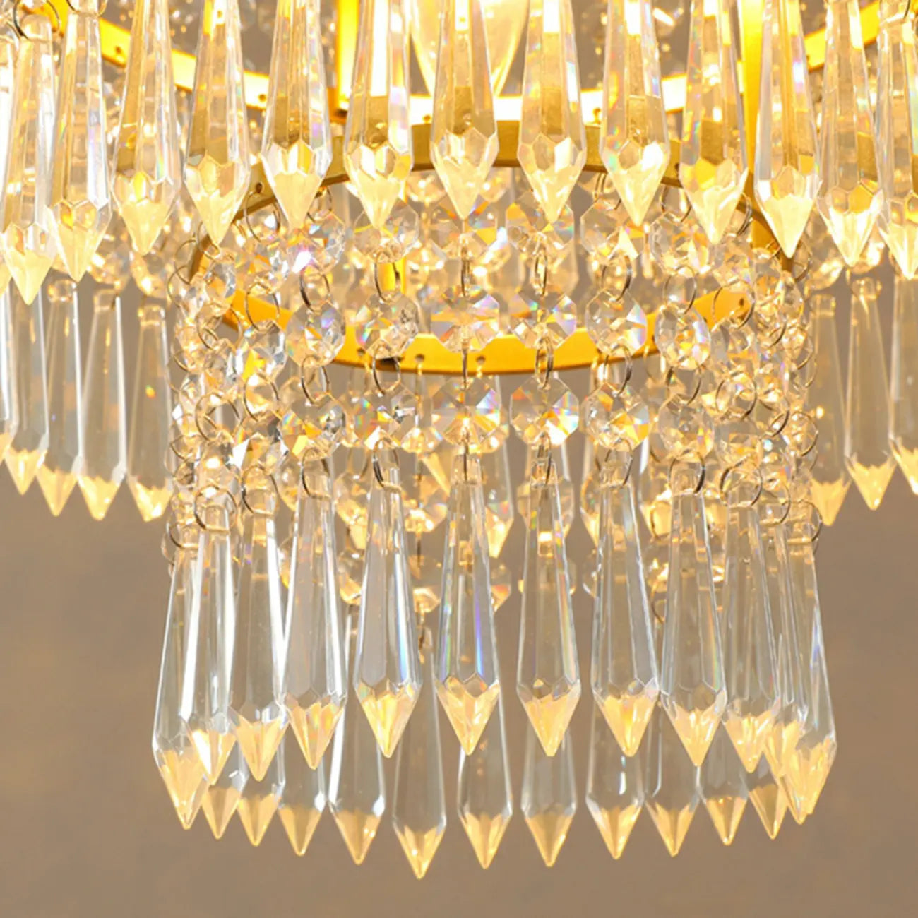 Lustre rond moderne en cristal doré à suspension descendante