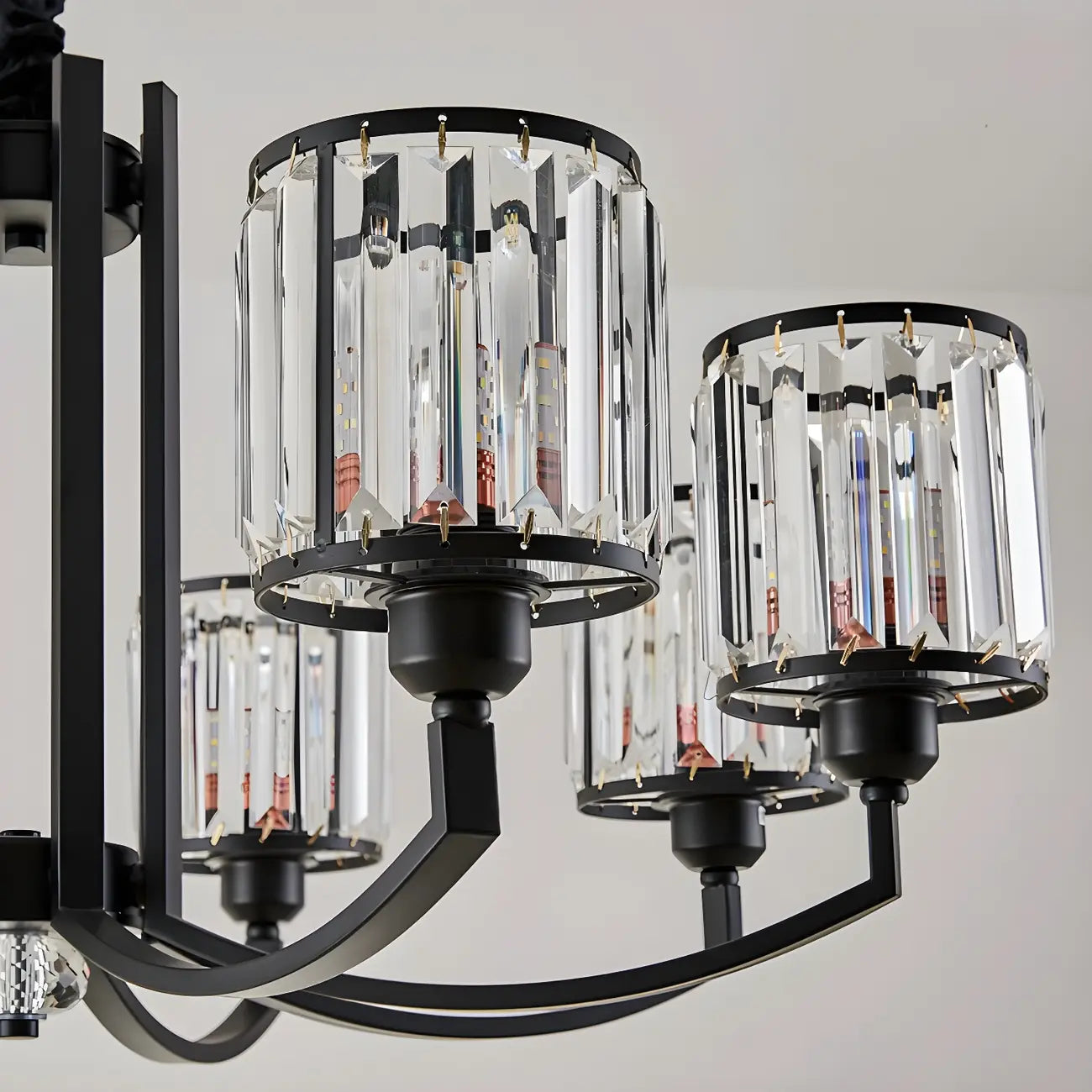 Lustre moderne en forme de cylindre de roue en métal noir et cristal pour salon ou hall d'entrée