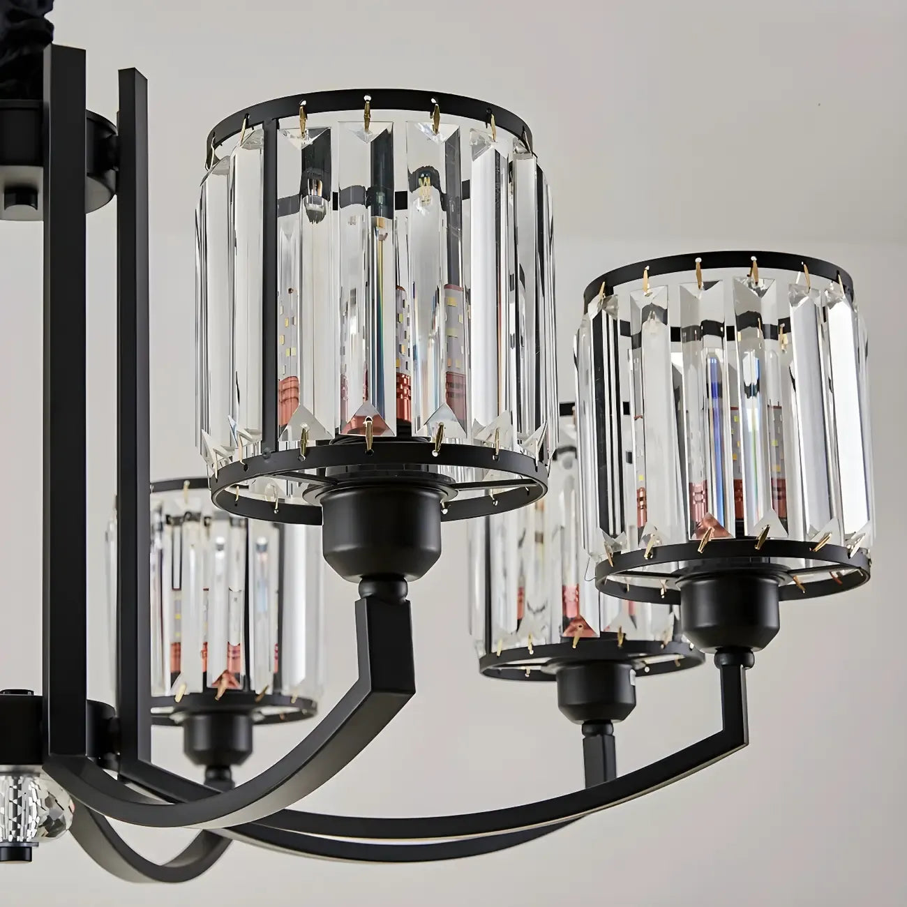 Lustre moderne en forme de cylindre de roue en métal noir et cristal pour salon ou hall d'entrée