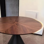 Table de salle à manger moderne ronde en bois brun avec piètement conique en métal