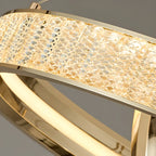 Lustre élégant à LED en cristal et anneaux dorés de luxe