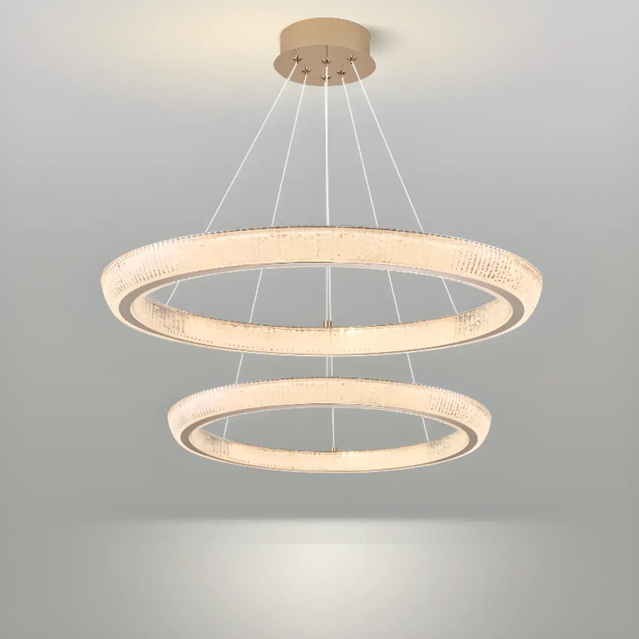 Lustre LED glamour en cristal doré à plusieurs cercles