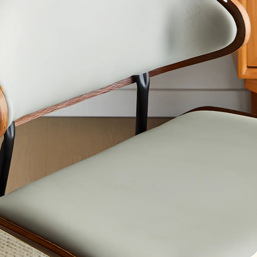 Chaise de salle à manger à dossier incurvé et assise en cuir noir