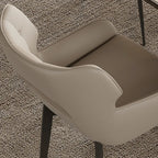 Chaise de salle à manger moderne en similicuir avec dossier ouvert et accoudoirs